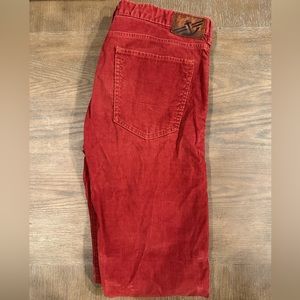 Red/rust colored corduroyed pants.